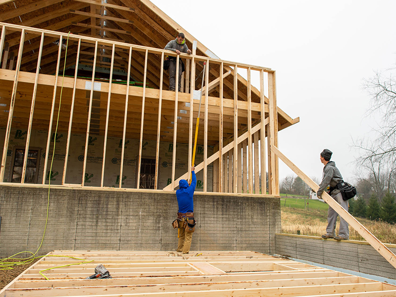 Man building house